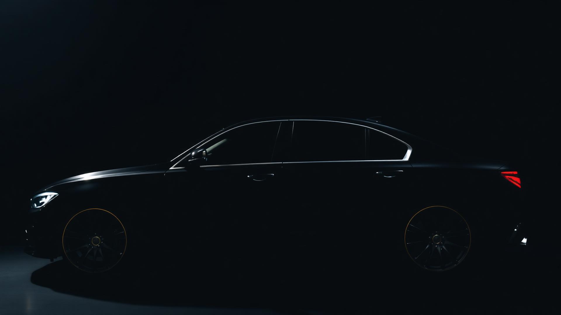 Detailed luxury black sedan glowing under studio light